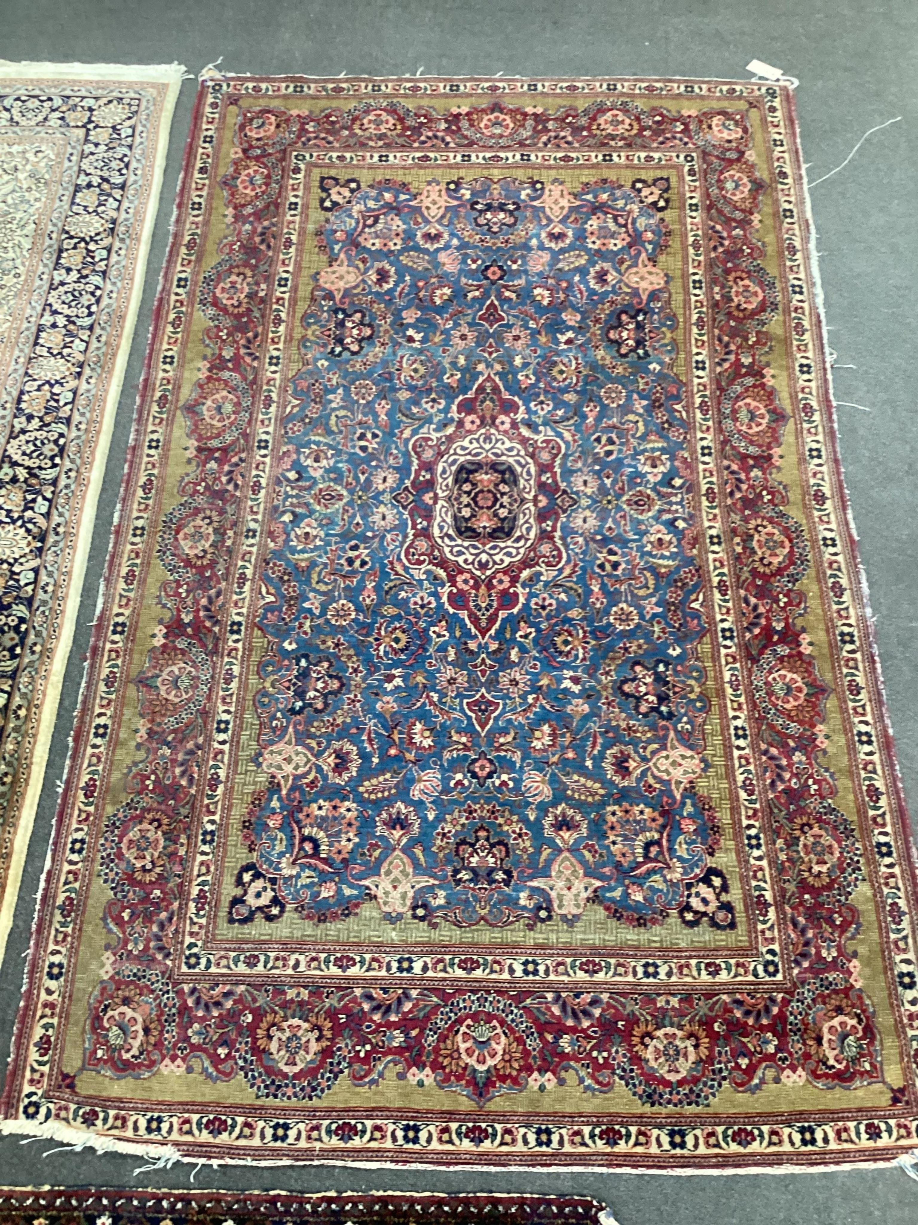 A Kashan blue ground rug, 214 x 128cm. Condition - fair